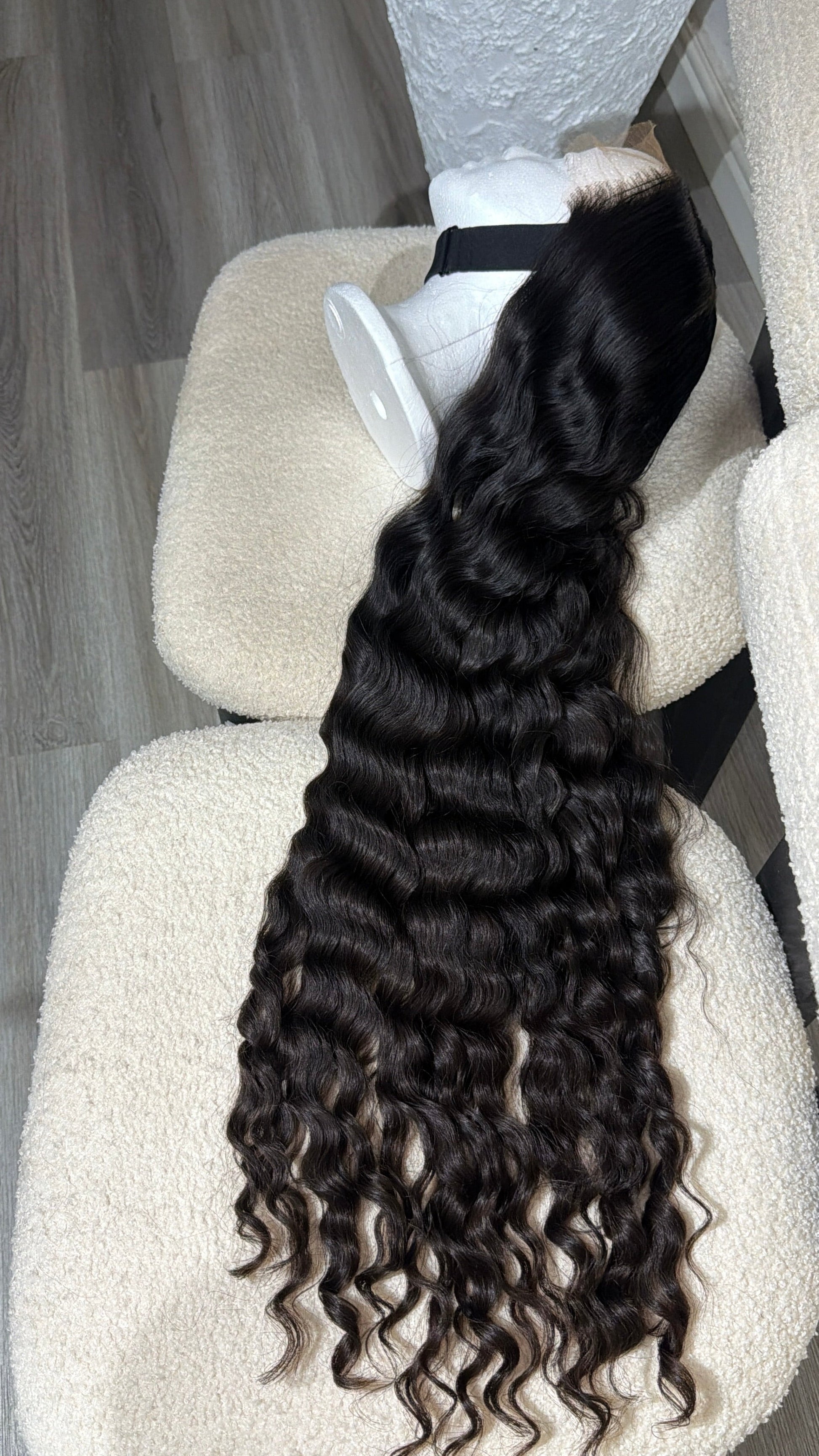 Side view of the 30-inch Russian Curly raw human hair wig featuring an HD lace closure and full, voluminous curls.