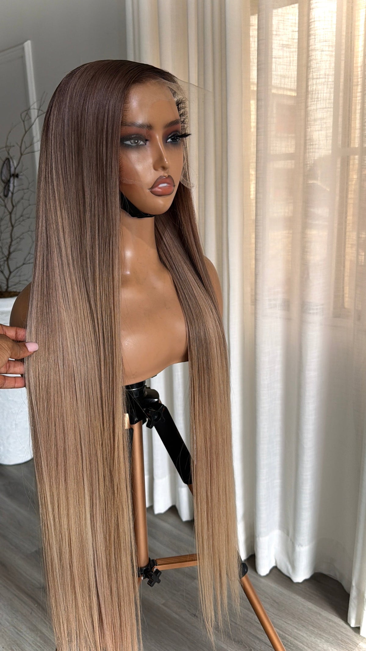 Side view of the Blush Blonde 28-inch raw human hair wig featuring a premium 13x6 HD lace frontal and silky straight texture.