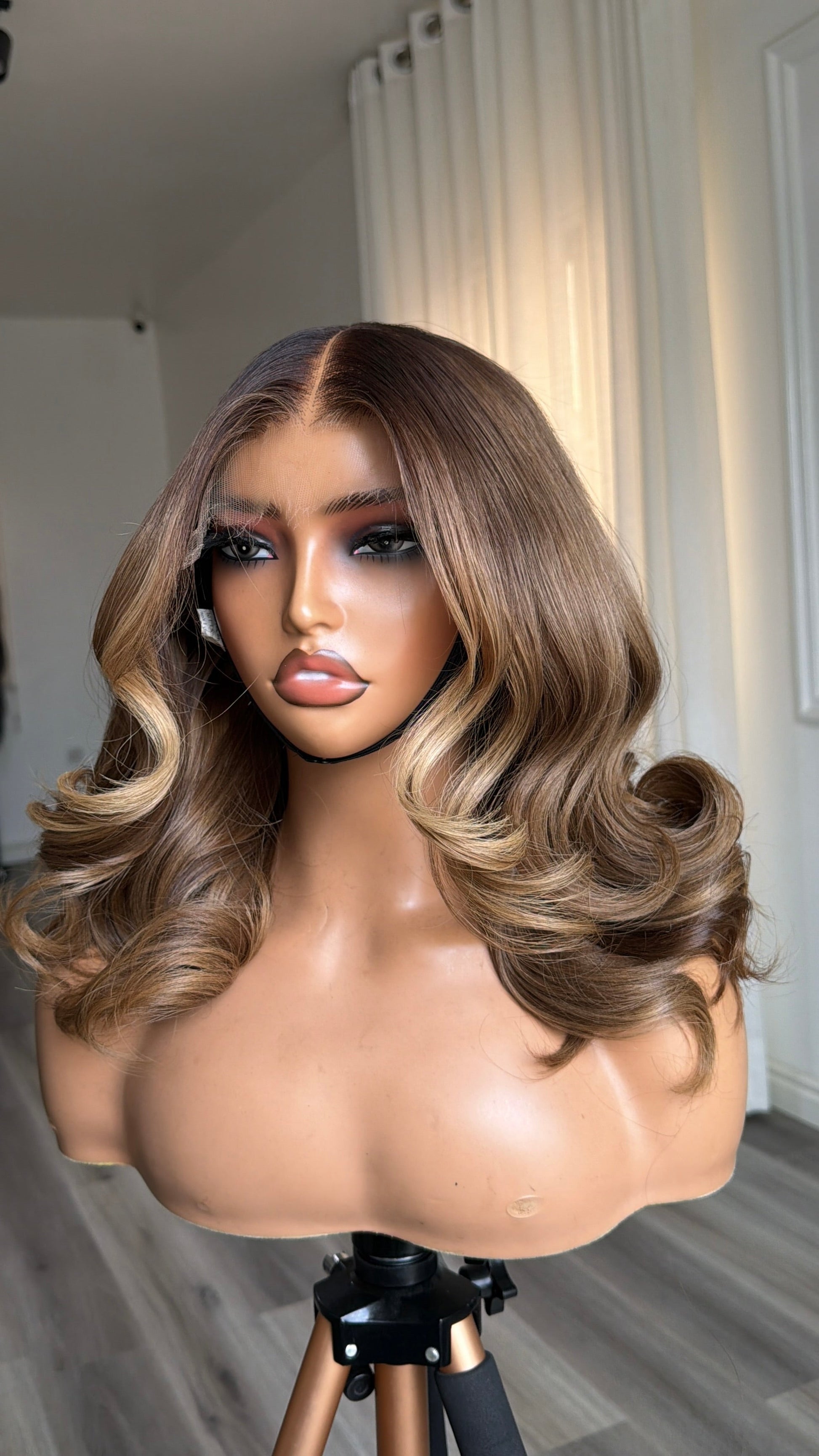 Back view of the Cashmere Unit 12-inch raw human hair wig showcasing its smooth finish, natural movement and premium 6x6 HD lace closure.